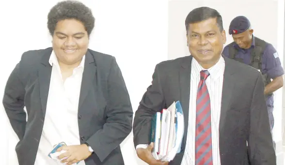  ?? Photo: Vilimoni Vaganalau ?? National Federation Party (NFP) Opposition members Roko Tupou Draunidalo (left), and Biman Prasad outside Parliament this week.