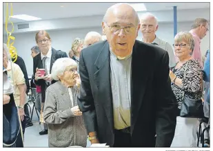  ?? DESIREE ANSTEY/ JOURNAL PIONEER ?? Reverend Joseph Brazel cuts into his retirement anniversar­y cake, and closes the chapter on his service with a few laughs, tears, and wise advice at St. Paul’s Church in Summerside.