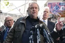  ?? JOSE LUIS MAGANA — THE ASSOCIATED PRESS ?? Steve Bannon, center, a longtime ally of former President Donald Trump, accompanie­d by his attorneys David Schoen, left, and Evan Corcoran, right, speaks to the media as he leaves the federal courthouse in Washington on Friday. Bannon was sentenced to 4 months behind bars for defying a Jan. 6committee subpoena.