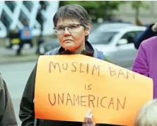 ??  ?? A woman protests against President Donald Trump’s revised travel ban outside a federal courthouse in
Seattle in this file photo. (AP)