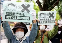  ?? DU XIAOYI / XINHUA ?? Japanese protest in Tokyo in April 2021 over their government’s discharge plan. The release of the toxic water will begin in spring 2023.