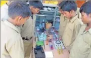  ?? HT FILE ?? Students with science kit at a government­run school.