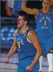  ?? MARK J. TERRILL — THE ASSOCIATED PRESS ?? Denver’s Nikola Jokic celebrates after a key second-half basket against the Clippers on Friday in Game 5.