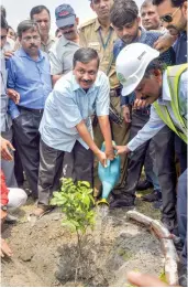  ?? — PTI ?? Delhi chief minister Arvind Kejriwal waters a plant during a visit to the Coronation Sewage Treatment Plant ( STP) site at Burari in New Delhi on Tuesday.