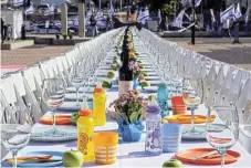  ?? /Reuters ?? Vacant places: A Sabbath dinner table is set with empty chairs that represent hostages and missing people with families waiting for them to come home in Tel Aviv, Israel, on October 20.