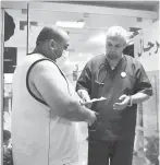  ??  ?? Bougroura (right), head of nephrology department at Batna’s university hospital talks to a transplant patient.