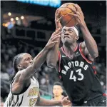  ?? KEVIN C. COX GETTY IMAGES ?? Pascal Siakam of the Toronto Raptors drives to the basket against Taurean Prince of the Atlanta Hawks. Siakam played 40 minutes and finished with career-high 33 points and 13 rebounds.