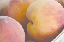  ?? STAFF FILE PHOTO ?? A basket of organic peaches is shown during the Chattanoog­a Market’s annual Peach Festival in 2015.