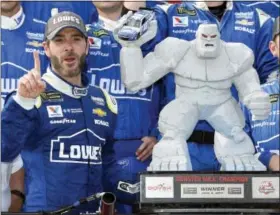  ?? NICK WASS — THE ASSOCIATED PRESS ?? Jimmie Johnson, left, poses in Victory Lane after a win at Dover Internatio­nal Speedway earlier this season.