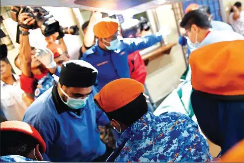  ??  ?? Rescue workers carry the body of 15-year-old Franco-Irish teenager Nora Quoirin, after it was found during a search operation, as it arrives at a hospital in Seremban on Tuesday.