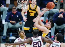  ?? MICHAEL CONROY / ASSOCIATED PRESS ?? Iowa center Luka Garza (55) averages 23.7 points and 8.8 rebounds per game this season, and has 12 double-doubles on the year. Iowa had won eight of nine games before losing to Illinois, 82-71, March 13 in the Big Ten conference tournament in Indianapol­is.