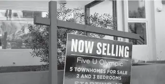  ?? Allison Dinner/Getty Images ?? A ‘for sale’ sign is displayed outside a townhouse style building on September 22, 2022 in Los Angeles, California. California’s homebuyer down payment assistance program goes live, and applicatio­ns will be evaluated via a lottery system.