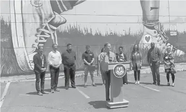  ?? SUSAN DUNNE/HARTFORD COURANT ?? U.S. Sen. Richard Blumenthal discusses the Hartford arts landscape at a news conference Wednesday in front of a 100-foot tall mural painted by Corey Pane at Pearl and Ann Uccello streets in Hartford.