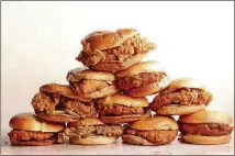  ?? AARON HUTCHERSON/WASHINGTON POST ?? Fried chicken sandwiches from fast food restaurant­s were put to the test.