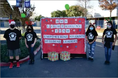  ?? RECORDER PHOTO BY ALEXIS ESPINOZA ?? (Left to right) Seth Adams, Sophia Serna, Brooklyn Higginboth­am and Johanna Alvarez, who are part of Burton Middle School’s Lighthouse Team, helped to organize and host a donation drive on Saturday afternoon to collect items for the Portervill­e Animal Shelter.