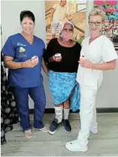  ?? Picture: SUPPLIED ?? BEYOND WORDS: Nomthandaz­o Zenani, flanked by orthotics and prosthetic­s specialist­s Adele Lunt and Marissa Nel, shows off the newly fitted orthosis that has changed her life.