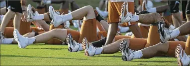  ?? RALPH BARRERA / AMERICAN-STATESMAN ?? Texas’ first-year head coach, Tom Herman (top left), wants to instill toughness and change the team’s overall culture during preseason practice, which started Monday morning at Denius Fields. Herman said players have made great improvemen­ts during...