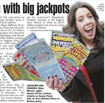  ?? STAFF PHOTOS BY MATT STONE ?? CROSSING HER FINGERS: Abby Meuse, right, shows off her Lottery tickets as Sunny Patel, left, of Joe's Market Place in Quincy grins.