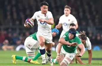  ?? — AFP photo ?? Smith makes a break during the Six Nations internatio­nal rugby union match between England and Ireland at Twickenham Stadium.