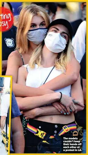  ??  ?? The models couldn’t keep their hands off each other at a protest in LA.