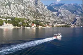  ?? AFP ?? The pandemic-induced tranquilit­y on Montenegro’s Kotor bay may provide a welcome change for a while but locals are worried about the economic future of a small country, reliant on tourism.