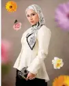  ?? ?? Model and influencer Shaha Meta wears a hijab, a long sleeved piña silk peplum top with a demure neckline and a buntal bag accented by a black agate.