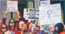  ?? BEBETO MATTHEWS/ASSOCIATED PRESS ?? Participan­ts carry signs and chant during the Internatio­nal Women’s Day rally in the shadow of Trump Tower in New York on Wednesday.