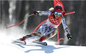  ?? AP Photo/Alessandro Trovati ?? ■ Czech Republic's Ester Ledecka competes in the women's super-G Saturday at the 2018 Winter Olympics in Jeongseon, South Korea. She won the gold medal.