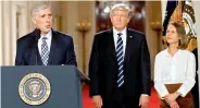  ?? — AP ?? Judge Neil Gorsuch speaks as his wife Louise and President Donald Trump stand with him on stage in East Room of the White House