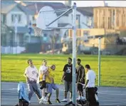  ?? Robert Durell
Los Angeles Times ?? YOUTHS PLAY basketball in Mountain House, which gets water from one rural irrigation district.