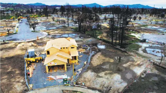  ?? Photos by Santiago Mejia / The Chronicle ?? A new home is going up at the end of Astaire Court in Santa Rosa’s devastated Coffey Park neighborho­od after the deadly Tubbs Fire ravaged Sonoma County.