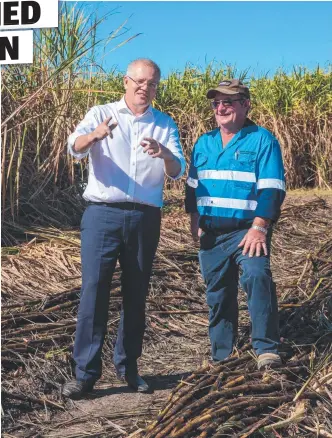  ??  ?? RECOVERY EFFORT: Prime Minister Scott Morrison is shown the devastatio­n from February flooding on a cane farm in Giru yesterday by harvesting contractor Gary Stockham.