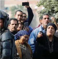  ?? Photo: Reuters ?? People gather near the site of attack.