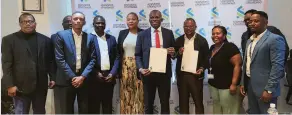  ?? ?? Standard Chartered and BOPRITU senior officials after signing the historic agreement