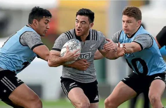  ?? GETTY IMAGES ?? Nehe Milnerskud­der, centre, tries to beat the tackles of Rieko Ioane, left, and Beauden Barrett during an All Blacks training run in Nelson this week.