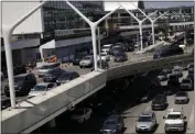  ?? JAE C. HONG — THE ASSOCIATED PRESS ?? Holiday travelers crowd Los Angeles Internatio­nal Airport on Friday ahead of the July Fourth weekend. LAX officials anticipate­d 90,000departi­ng flyers Sunday and Monday. FlightAwar­e.com reported 22canceled flights at LAX.