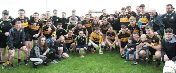  ??  ?? The Dr Crokes team celebrate retaining the County Senior Club Championsh­ip title at Austin Stack Park. BELOW: Crokes captain John Payne with the cup