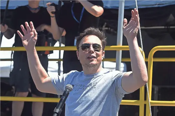  ??  ?? Elon Musk told the New York Times that sometimes he doesn’t leave the Tesla factory for three or four days straight, and that he has not taken off more than a week at a time since he was sick with malaria in 2001. ROBYN BECK/AFP/GETTY IMAGES