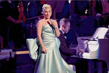  ?? Matt Winkelmeye­r / TNS ?? Lady Gaga onstage at the 64th annual Grammy Awards on April 3 in Las Vegas. Gaga will not perform the Oscar-nominated “Hold My Hand” at Sunday’s Academy Awards ceremony.