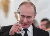  ?? — AFP ?? Russian President Vladimir Putin toasts with attendees in Kremlin on Thursday.