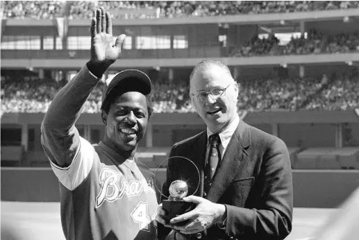  ?? AP FILE ?? Hank Aaron’s chase of the career home run record held then by Babe Ruth is one of baseball’s indelible memories from the 1970s.