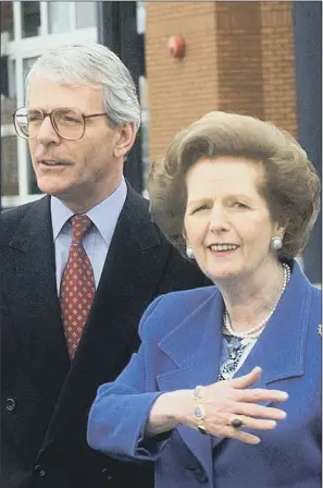  ??  ?? DIVIDED: Margaret Thatcher was convinced that John Major would continue to drive through her Poll Tax.