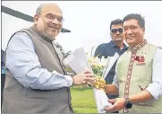  ?? PTI ?? Union home minister Amit Shah being welcomed by Arunachal Pradesh CM Prema Khand in Deomali on Saturday.