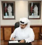  ??  ?? Minister of State for Energy Affairs HE Saad Sherida Al Kaabi signs the agreements in Doha on Monday.