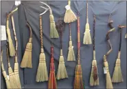  ?? ADAM DODD — THE NEWS-HERALD ?? Burton artist Chuck Fath had numerous handmade brooms on display during the 2019 Chardon Arts Festival.