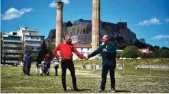  ?? — AFP photos ?? Artists Prinz Gholam perform 'My sweet country' at the Temple of Olympian Zeus in Athens yesterday, in the frames of the Documenta 14 art exhibition.