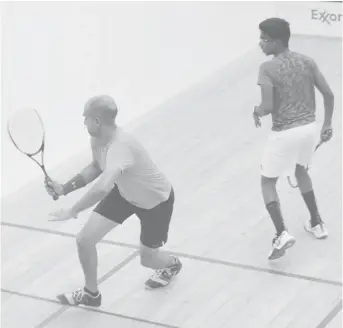  ?? (Orlando Charles photo) ?? Action from last night in the Lucozade Handicap Squash Tournament. Ryan Rahaman, +10, (left) attempting to make a backhand stroke in his match with Daniel Islam, -5. Islam won 15 – 10, 8 – 15, 15 – 12