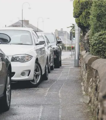  ?? PICTURE: SCOTT LOUDEN ?? 0 A law banning parking on pavements has been hailed as a milestone