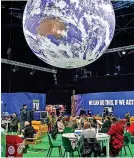  ?? ?? A giant globe hangs from the ceiling at the COP 26 Climate Change Conference