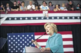  ?? MAX WHITTAKER / THE NEW YORK TIMES ?? Hillary Clinton delivers a speech in Reno, Nev., Thursday where she linked Donald Trump’s campaign to fringe ideologies. In turn, Trump is trying to paint Clinton as a racist.